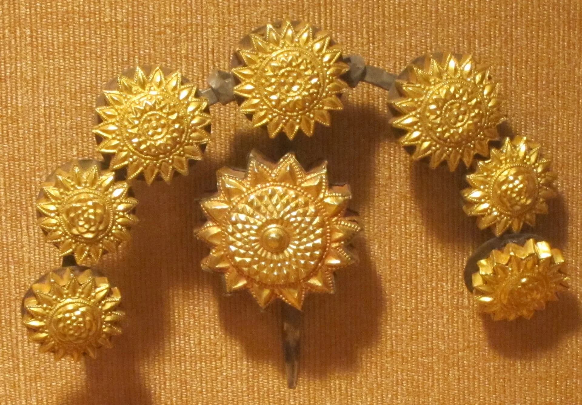 A traditional gold hair ornament from Karnataka made of flower-shaped pieces