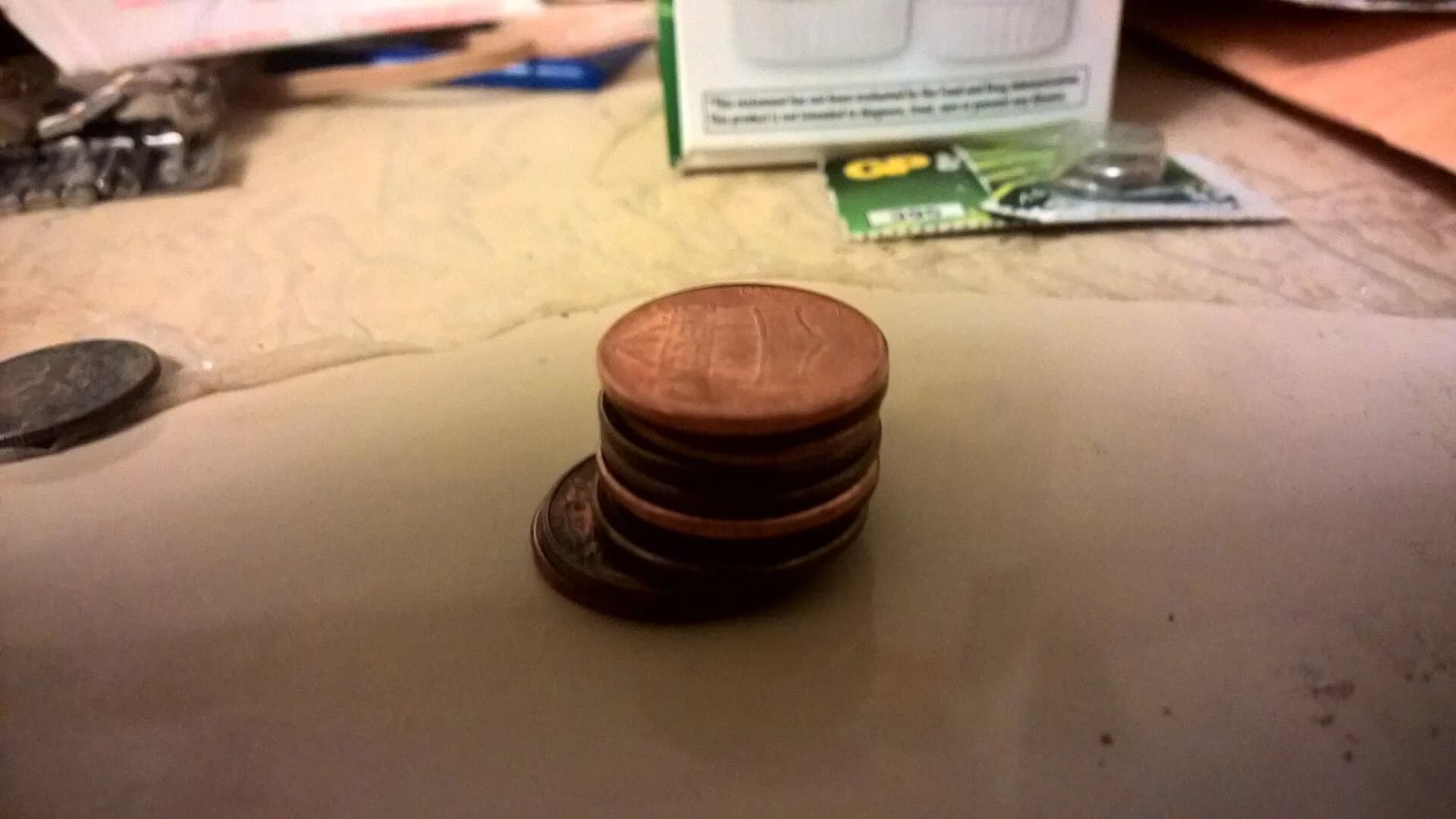 A tall stack of copper coins