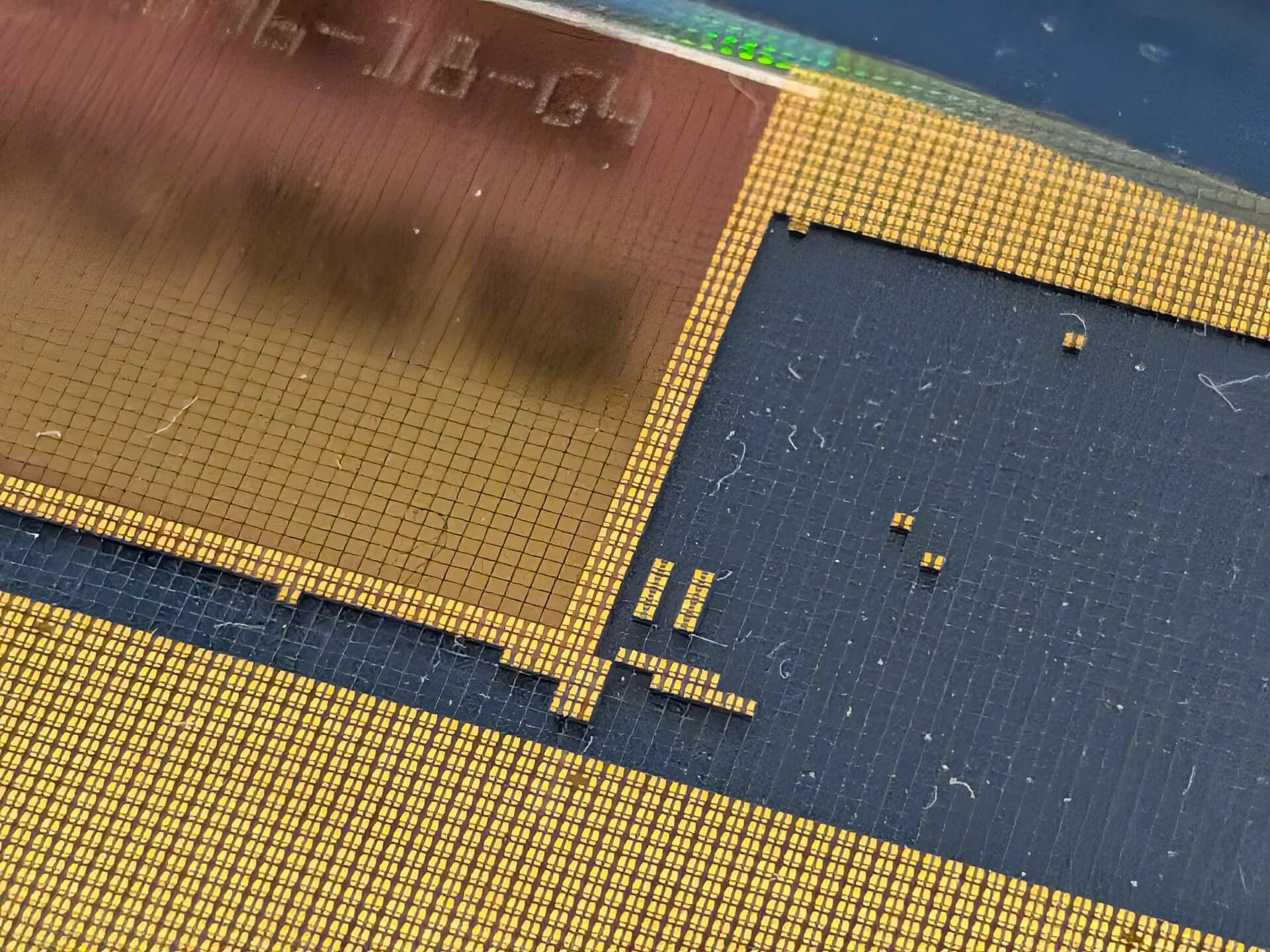 Close-up of the gold contact pads on a chip package