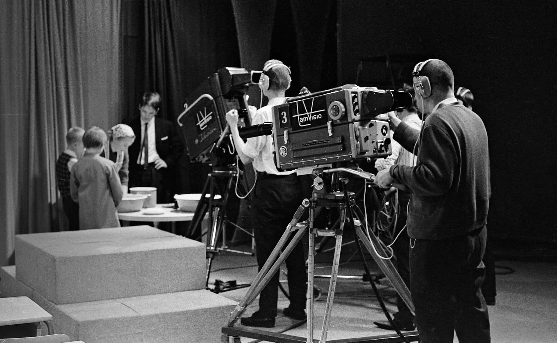 Camera operators filming in a television studio