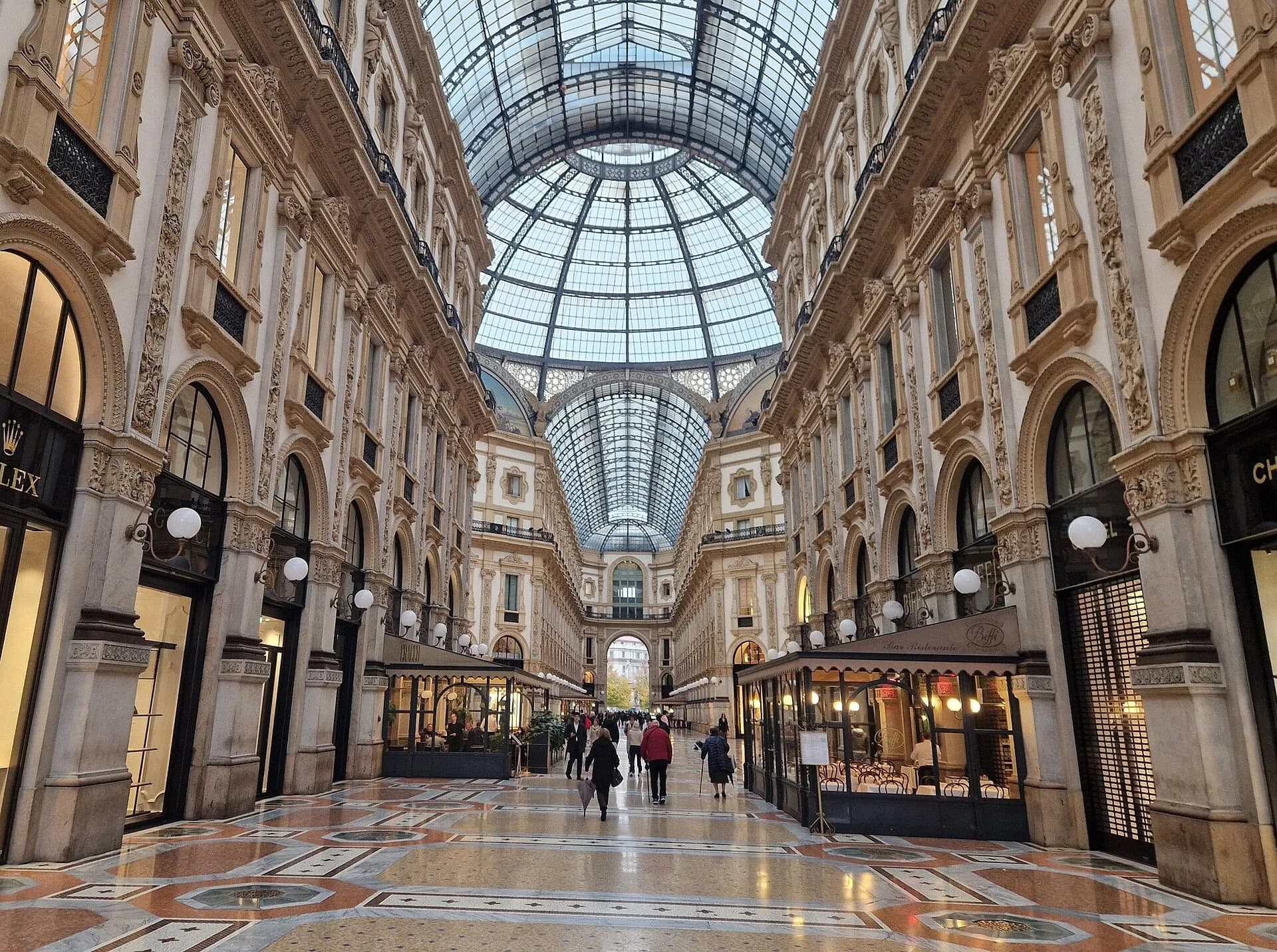 The glass-roofed arcade of the Galleria Vittorio Emanuele II in Milan, lined with luxury shops