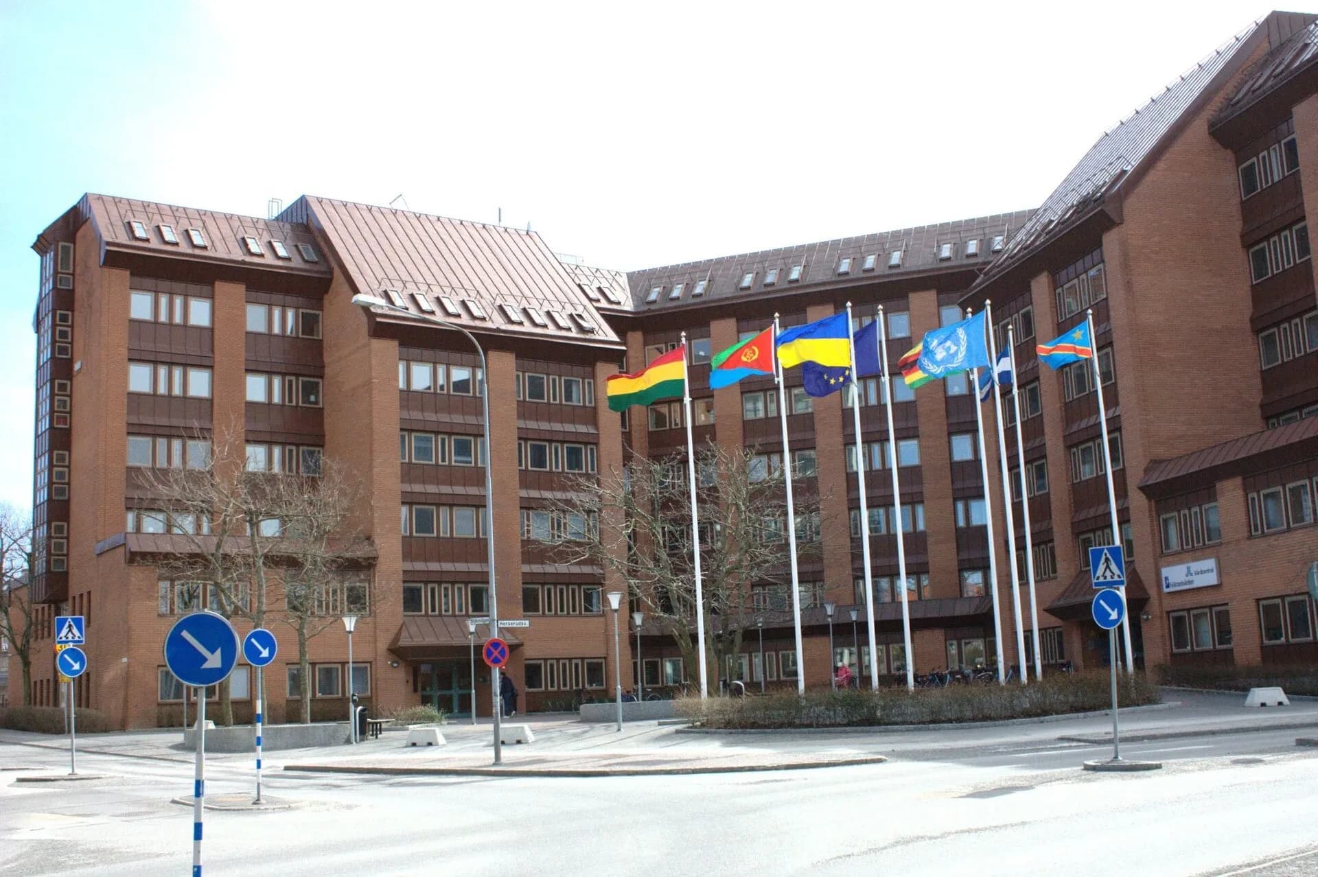 Flags flying outside a large international building