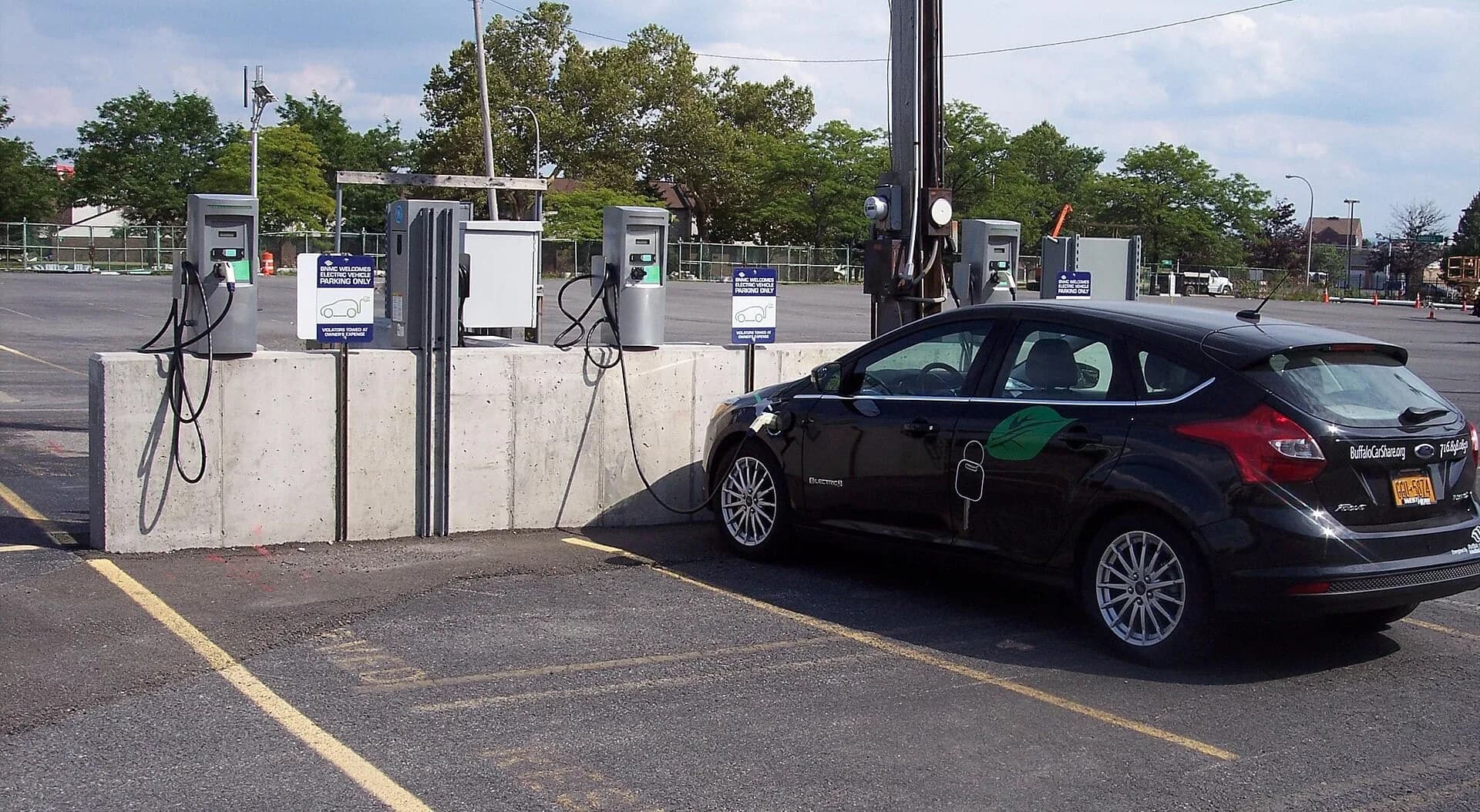 A car charging at an electric vehicle charging station
