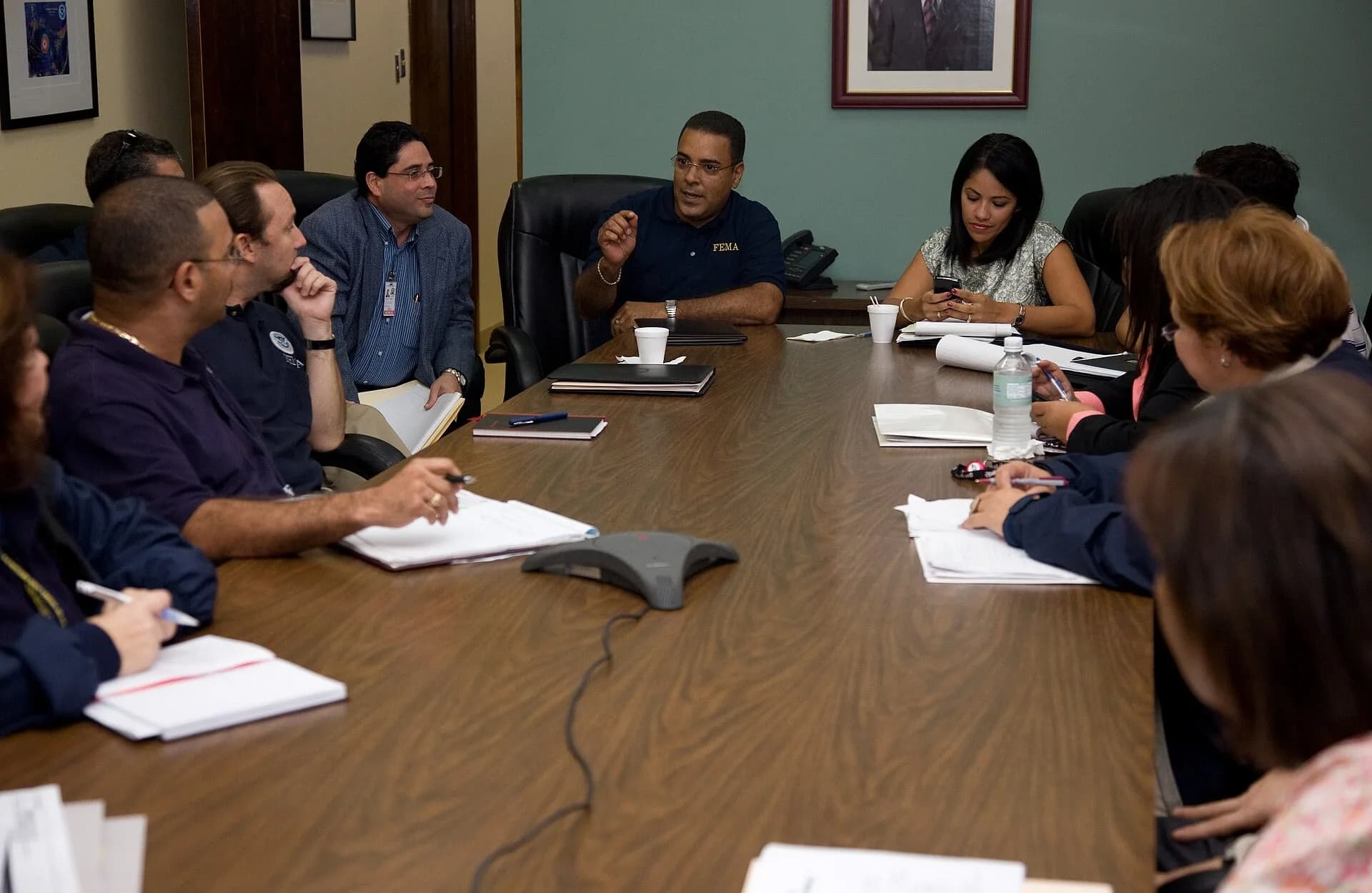Office workers sitting around a table in a meeting