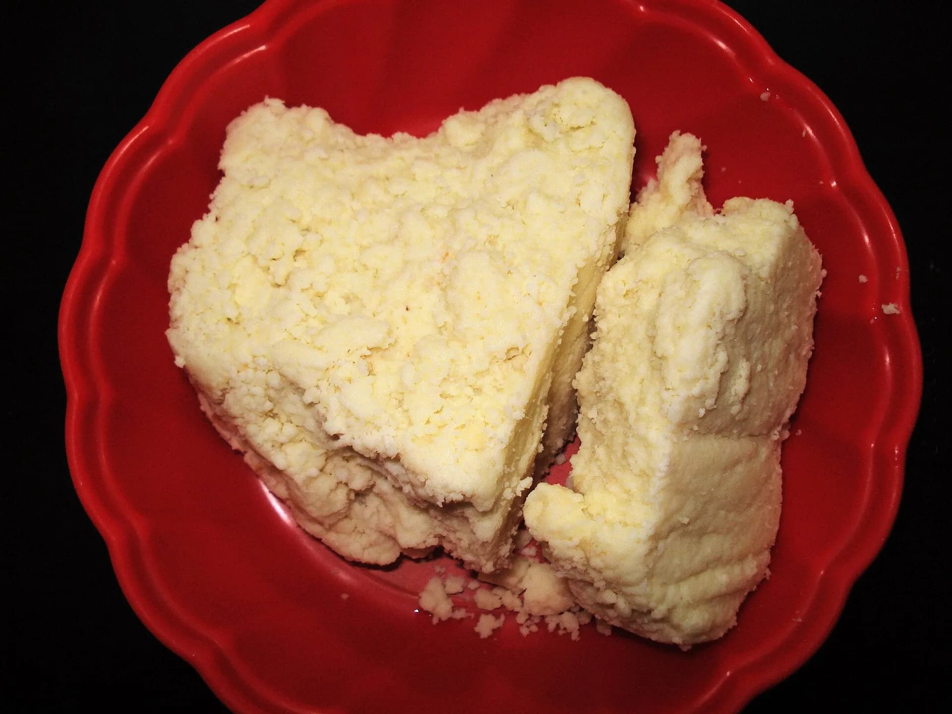 A milk-based sweet on a red plate