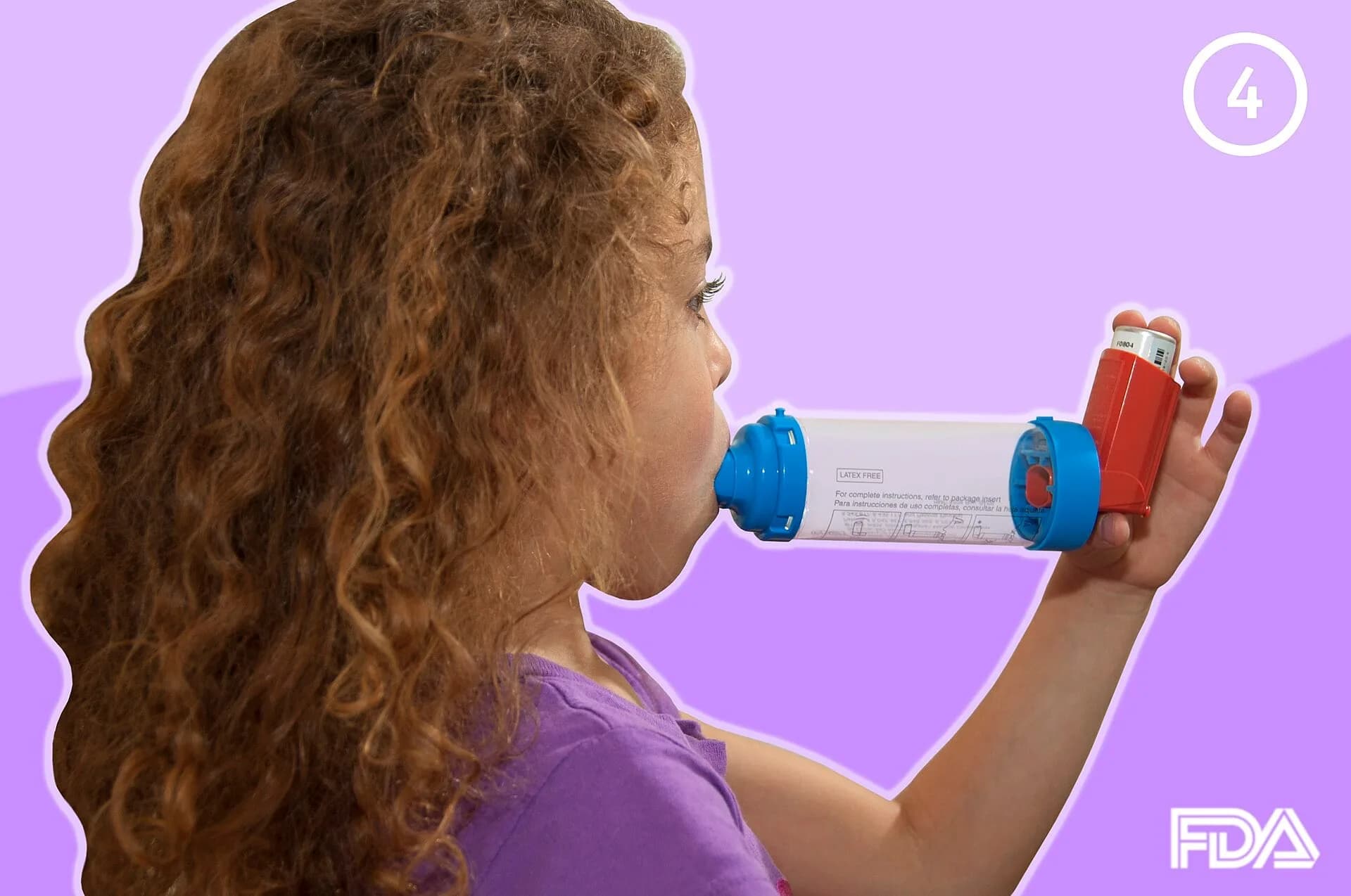 A child using an asthma inhaler with a spacer