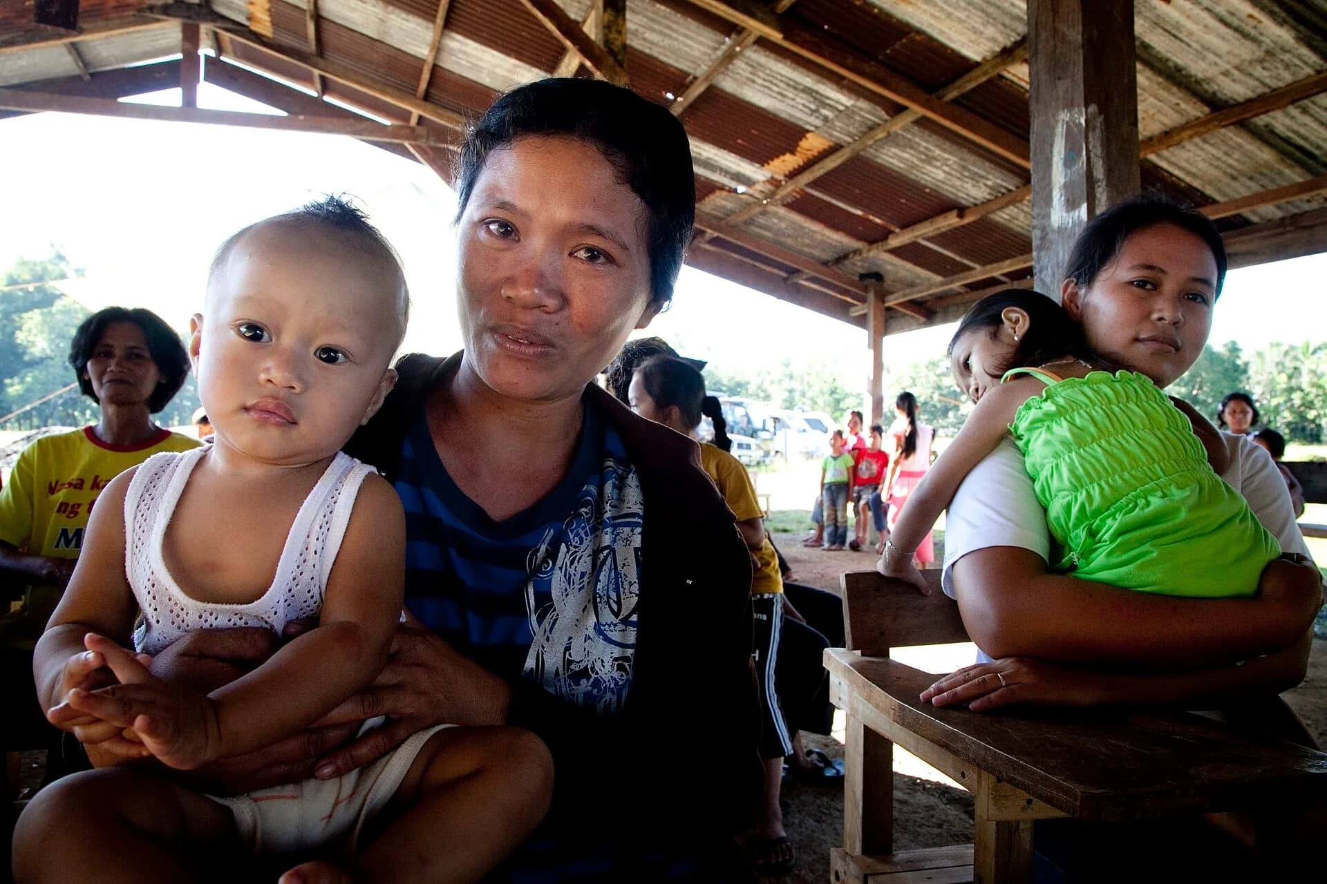 Young mothers sitting with their children