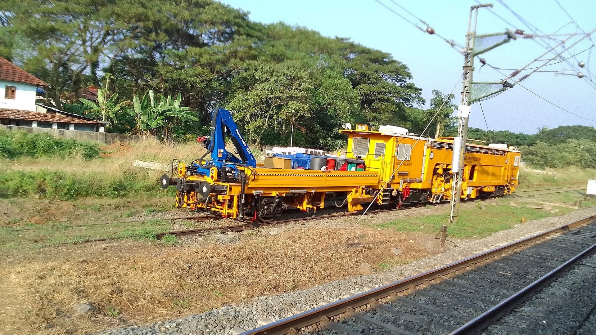 Indian Railways staff working on a train track