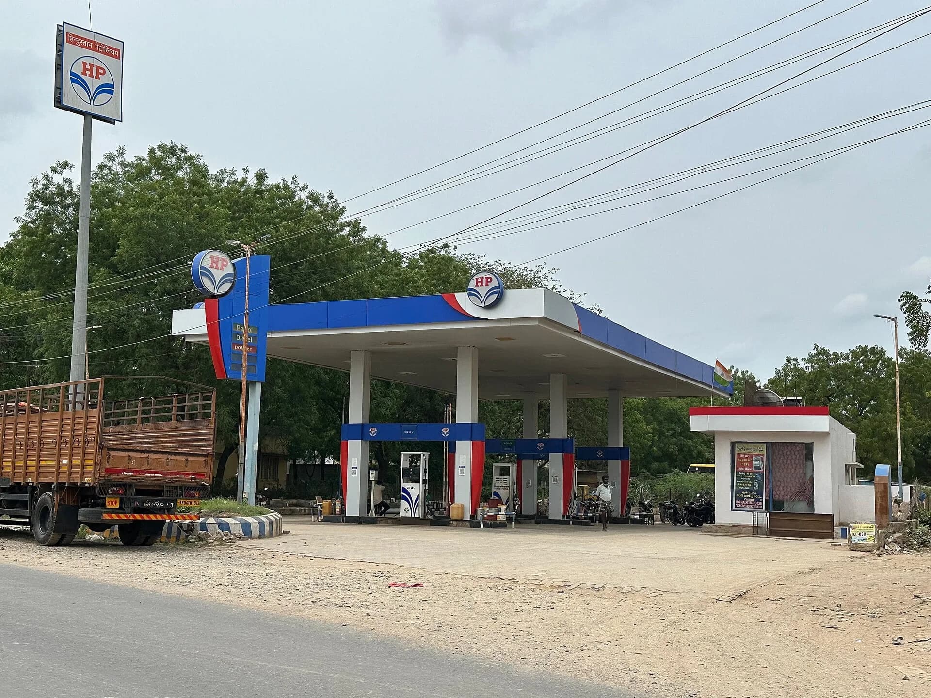 A roadside petrol pump in Andhra Pradesh with a truck parked nearby