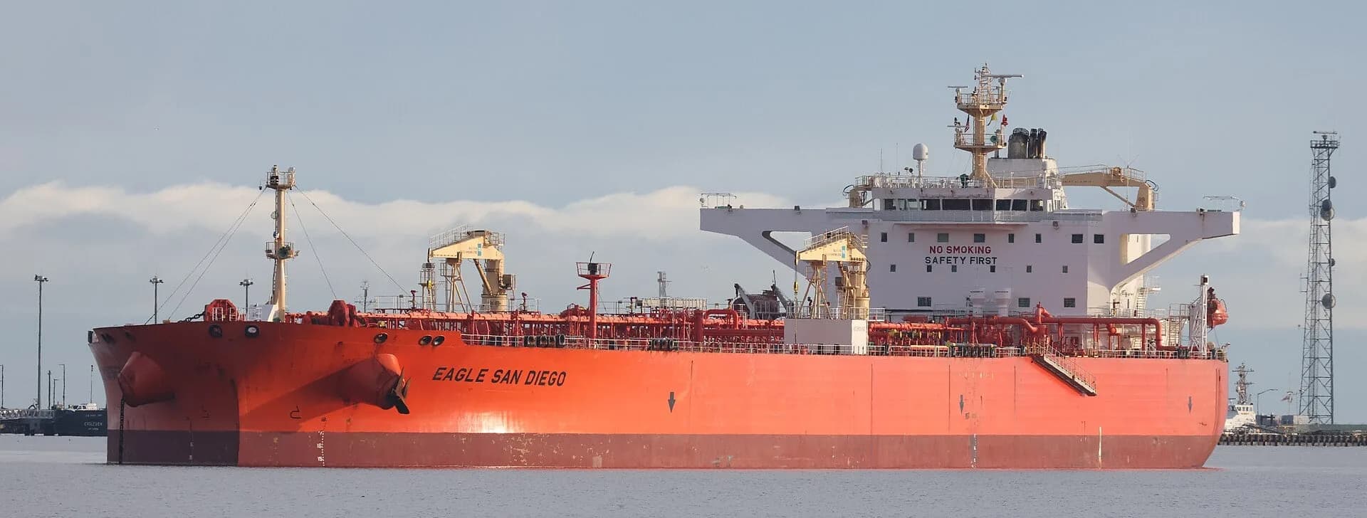A large red crude oil tanker at sea