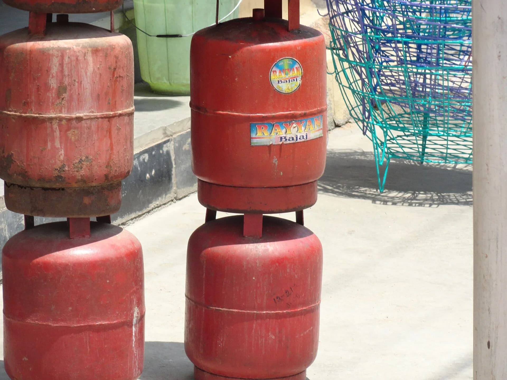 Red LPG gas cylinders stacked together