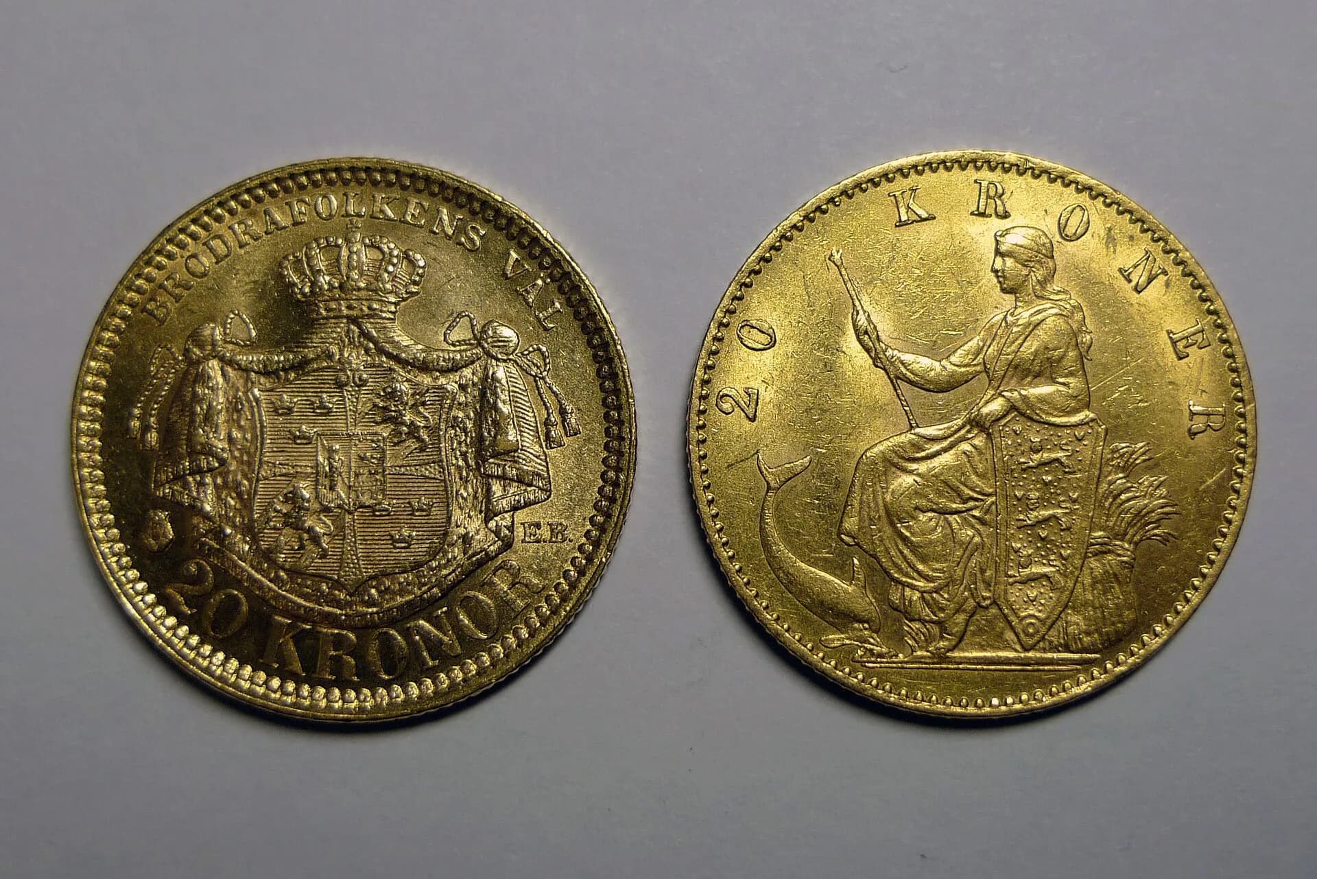 Two gold coins shown front and back