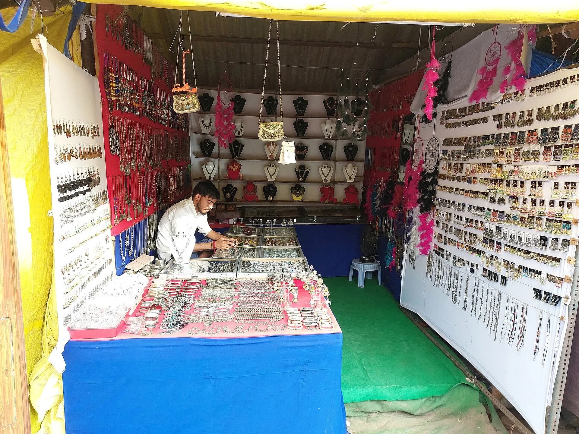 A jewellery stall displaying necklaces and earrings