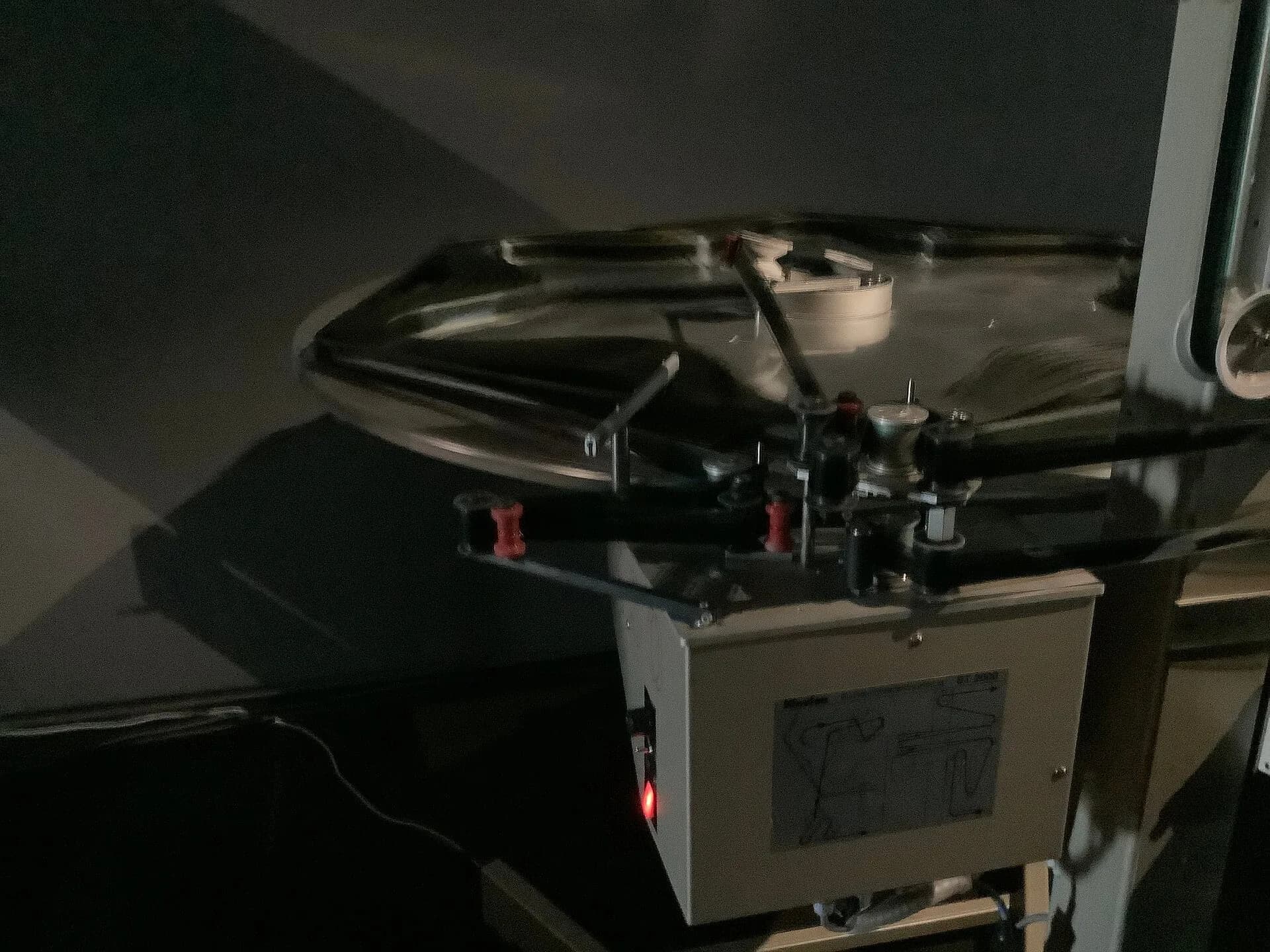 A reel of film mounted on a large-format cinema projector