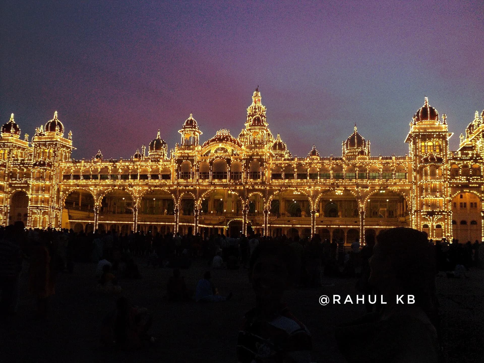 Mysore Palace lit up with thousands of bulbs at dusk