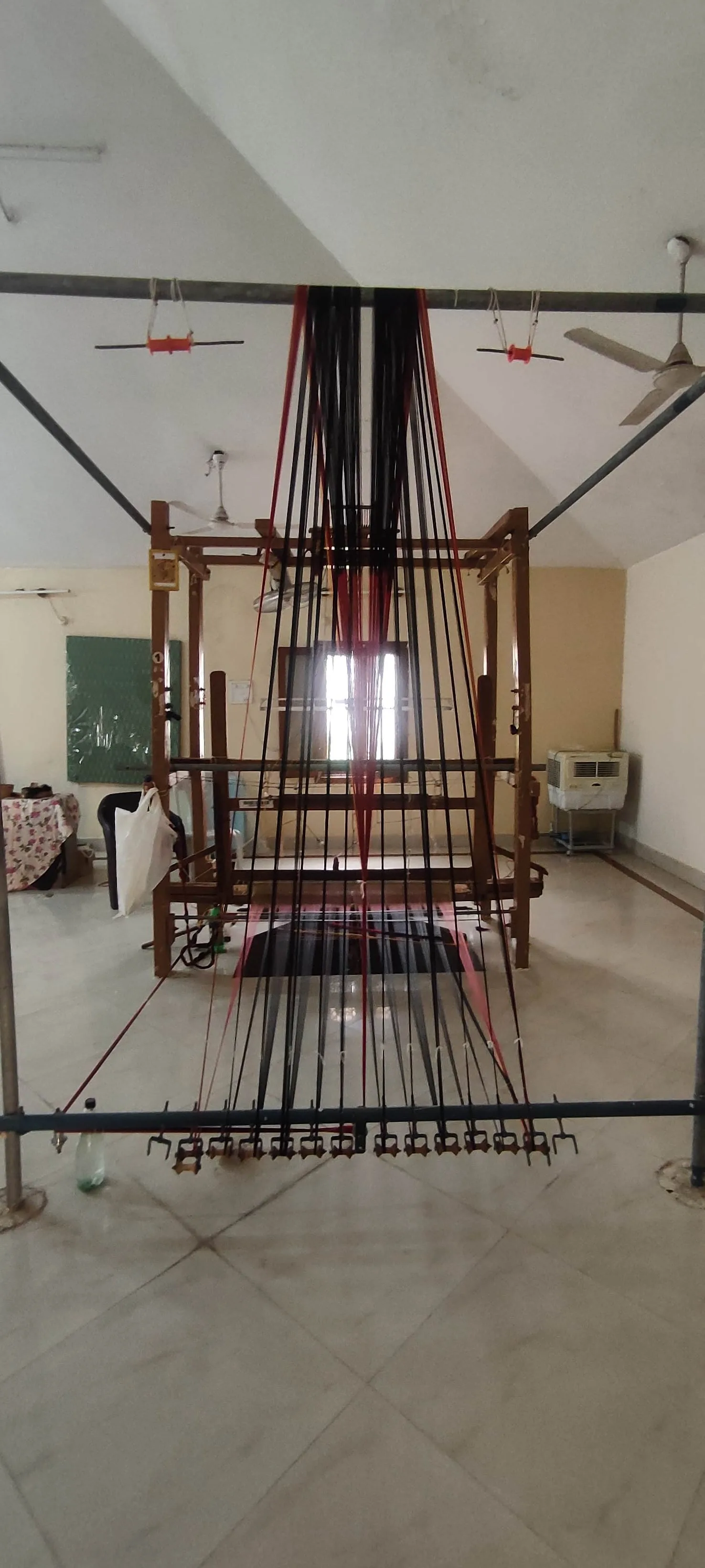 A large wooden handloom in a workshop