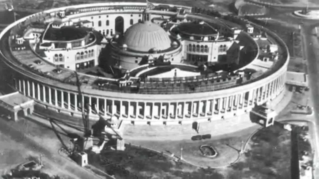An aerial black-and-white view of the circular Parliament House in New Delhi