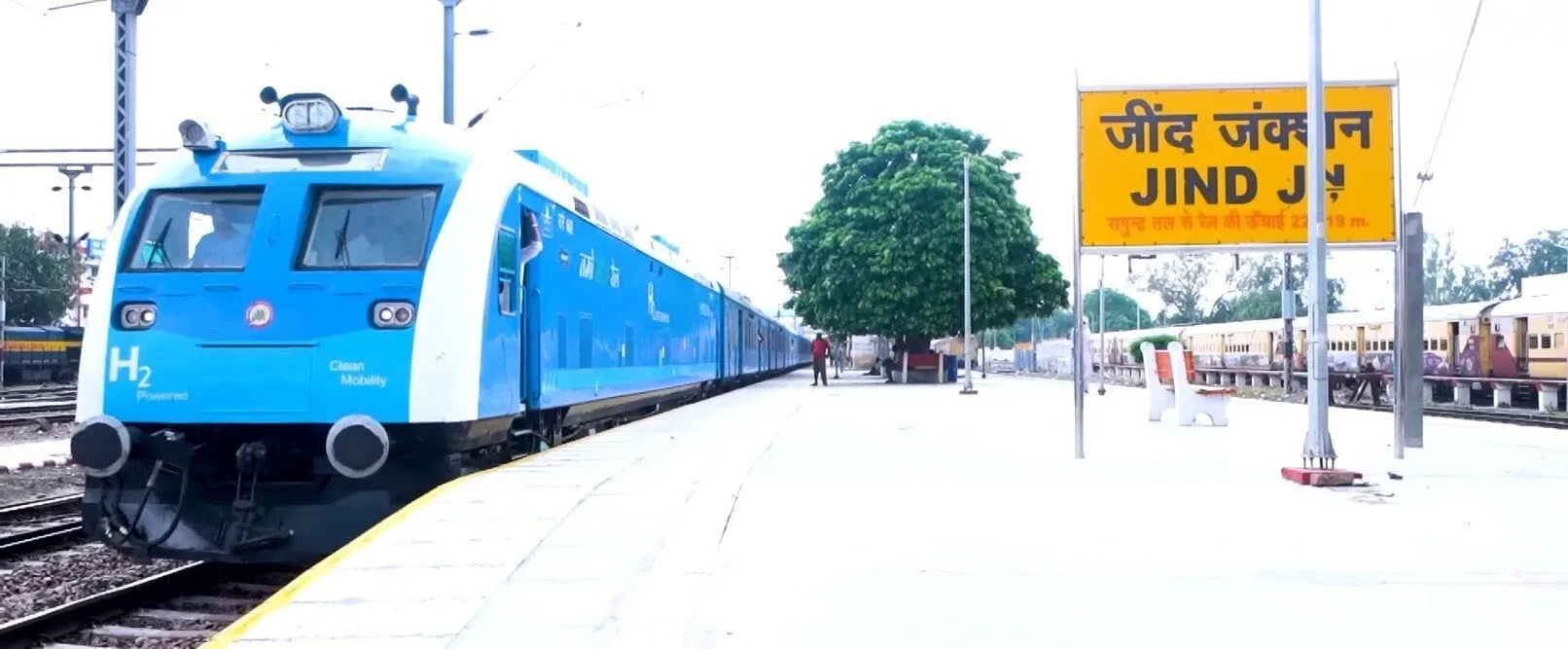 A blue and white train at Jind Junction station in Haryana