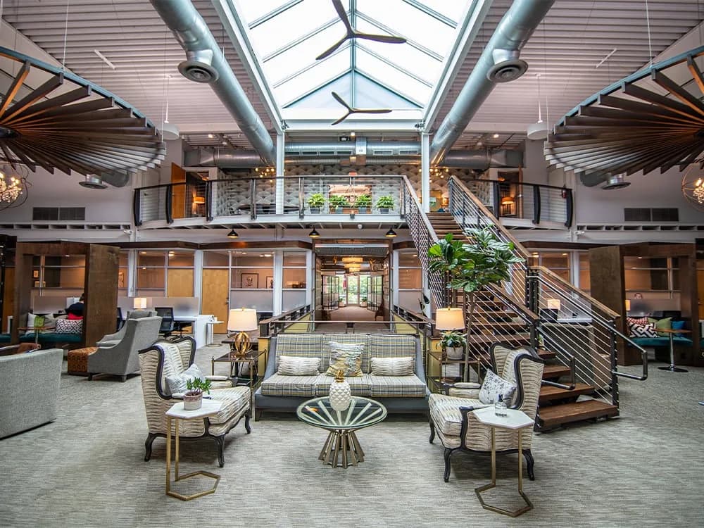 A bright modern office atrium with seating areas