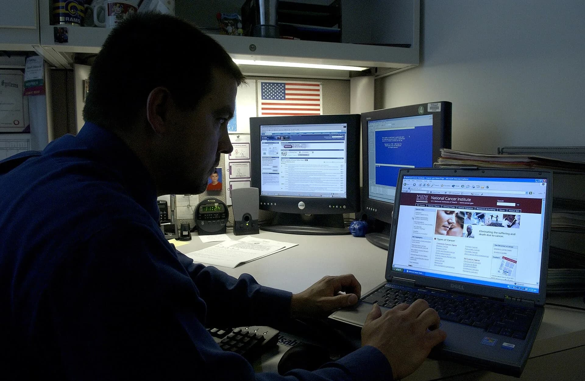 A man using a laptop at a desk