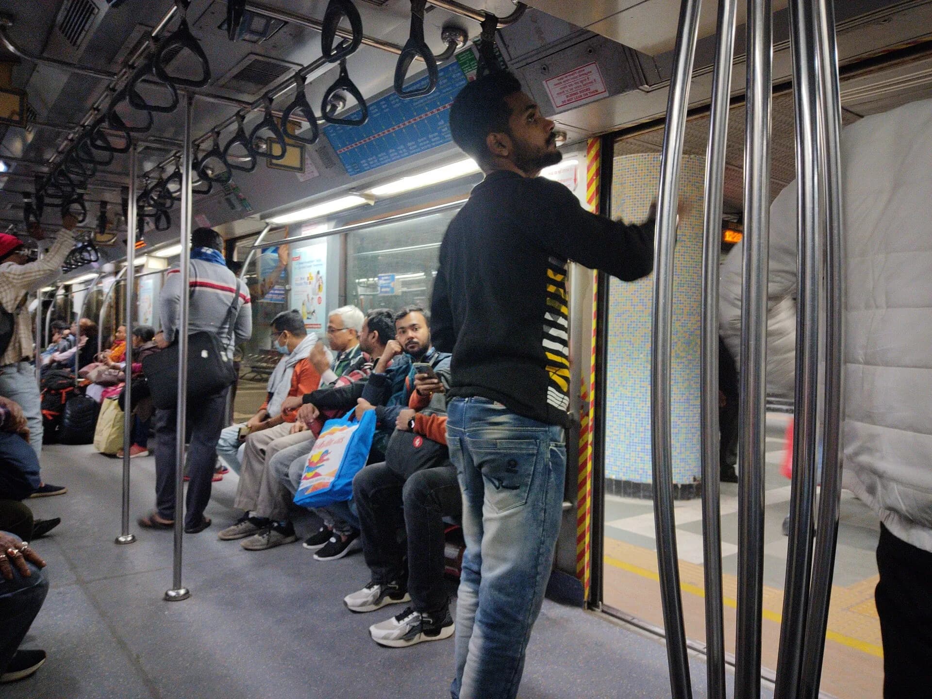 Passengers inside a Kolkata Metro train