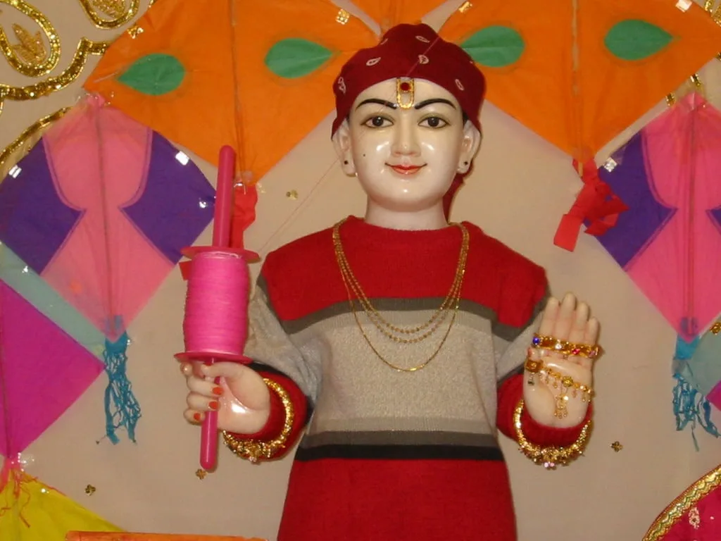 An image of Swaminarayan flying a kite for Uttarayan at a temple