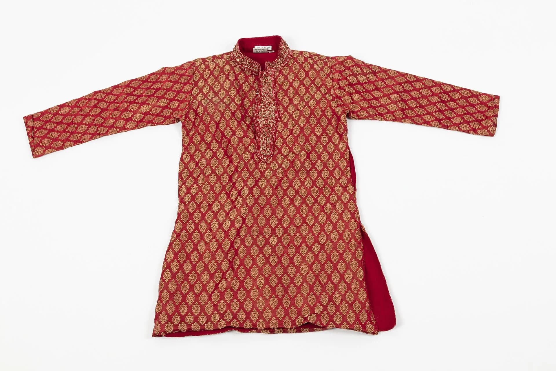 A red brocade kurta with gold pattern