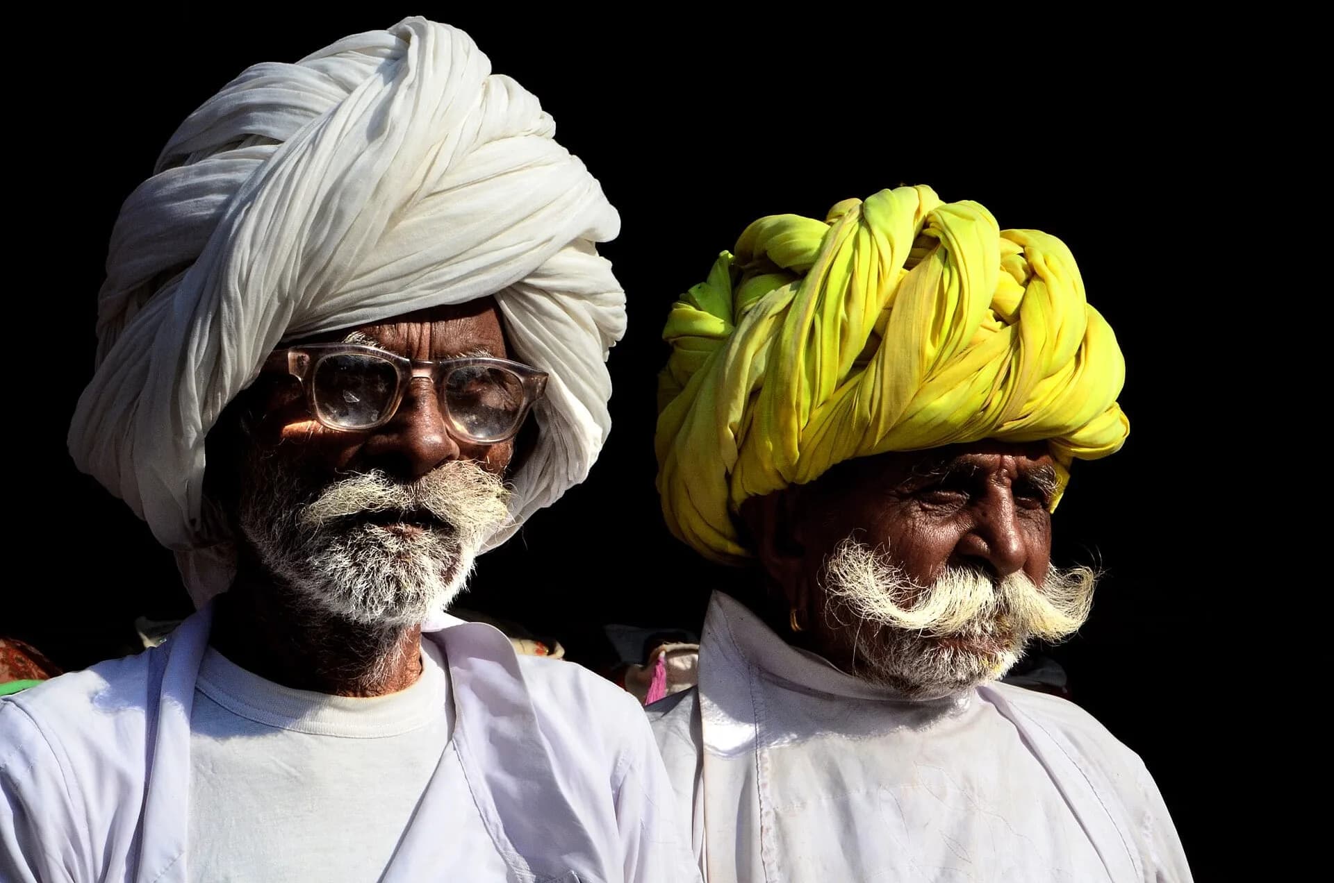 Two men wearing bright Rajasthani turbans