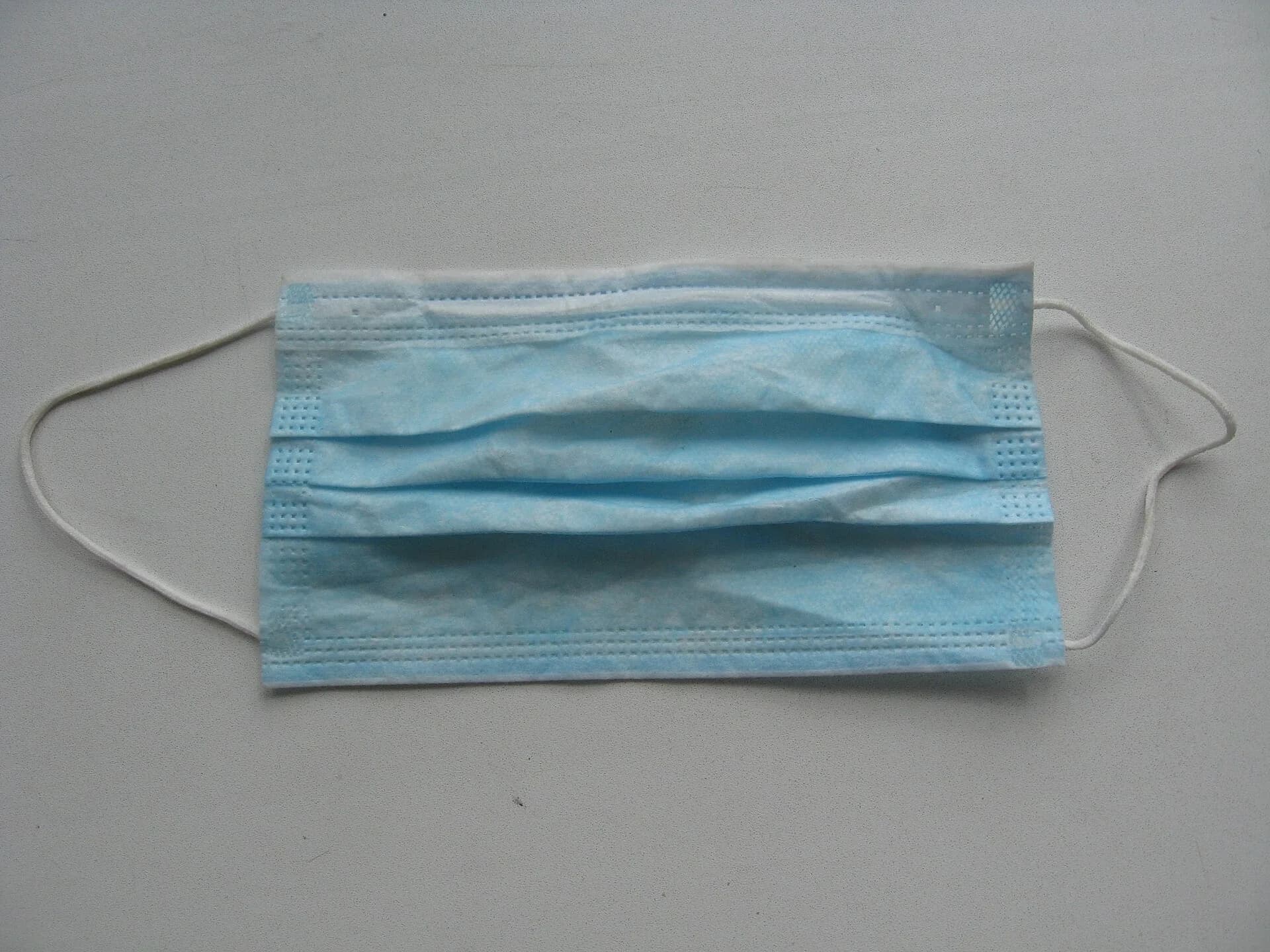 A blue surgical face mask