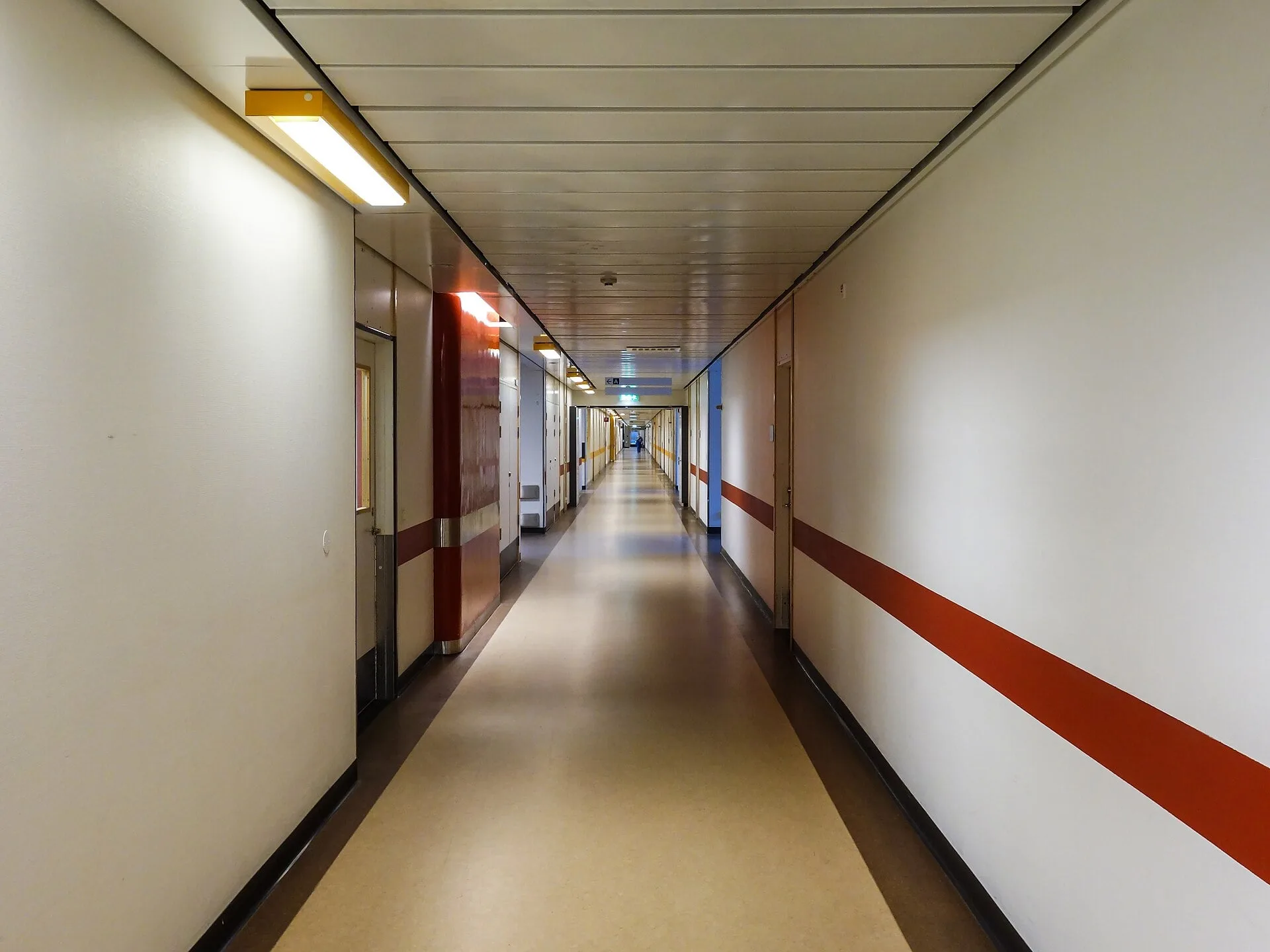 A long, empty hospital corridor