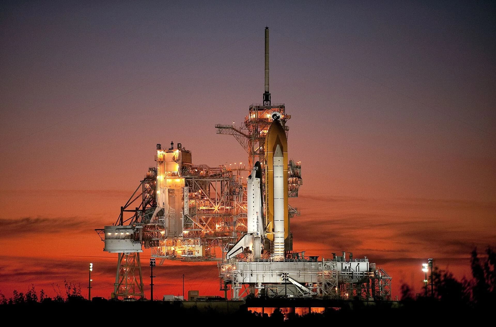 A rocket on its launch pad at sunset