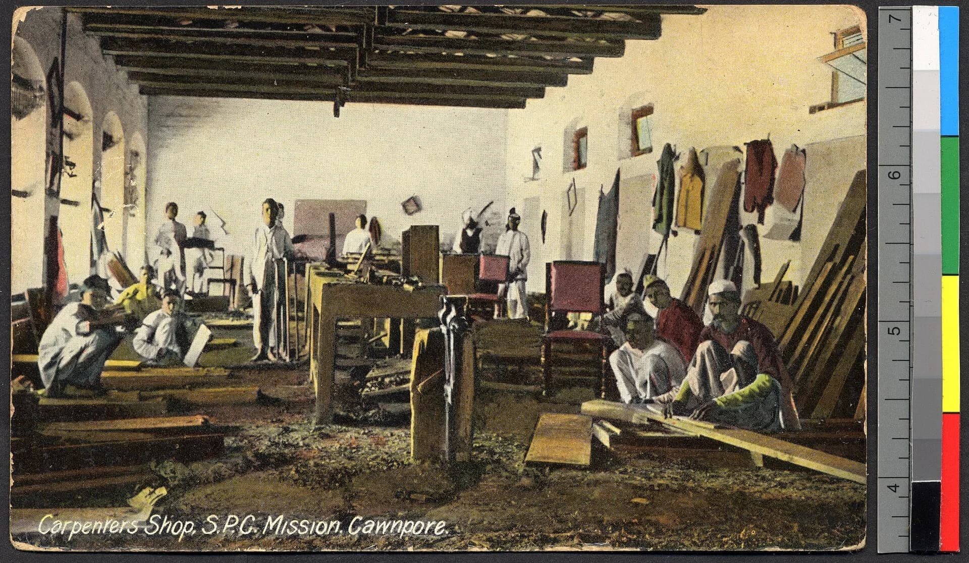 Young men at work in a carpenter's workshop in Kanpur, India, in an archive photograph from about 1914