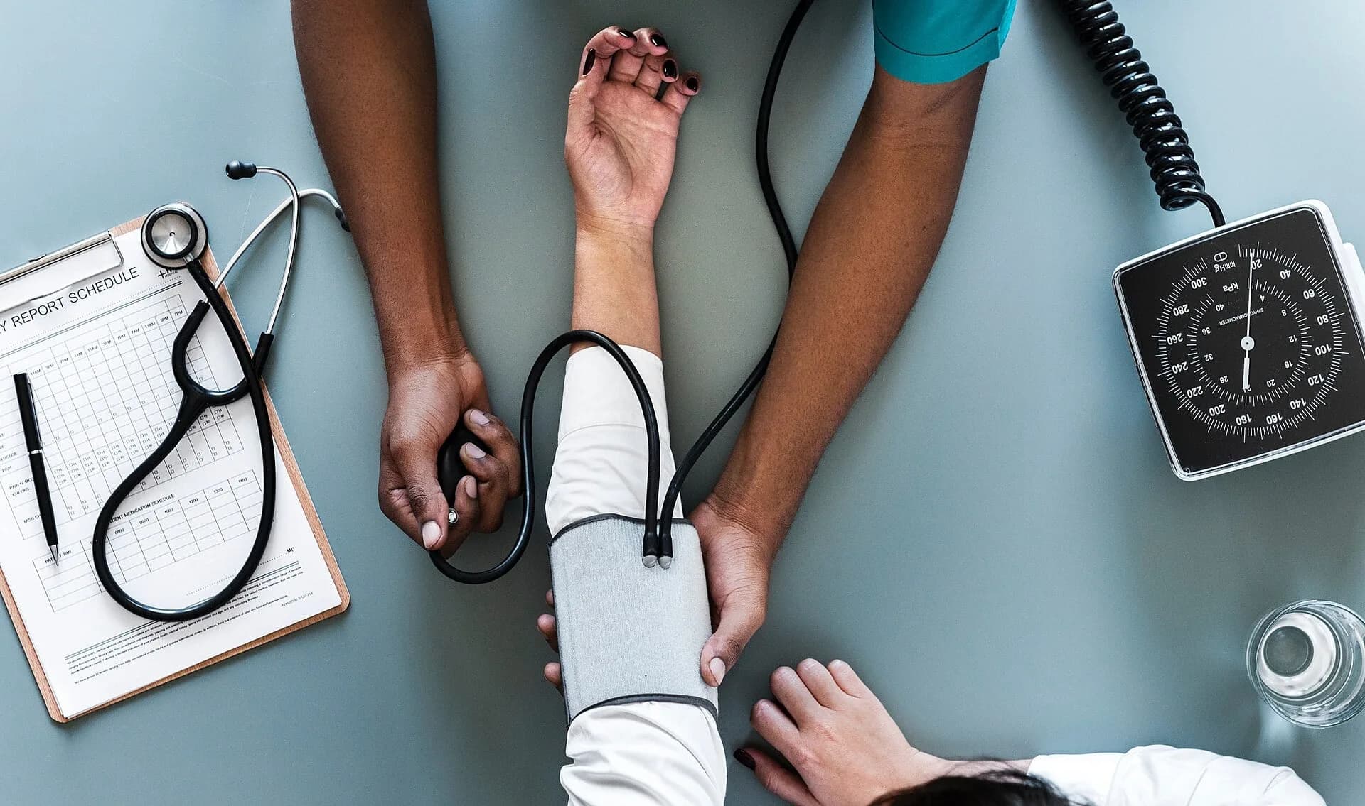 A health worker measuring a person's blood pressure