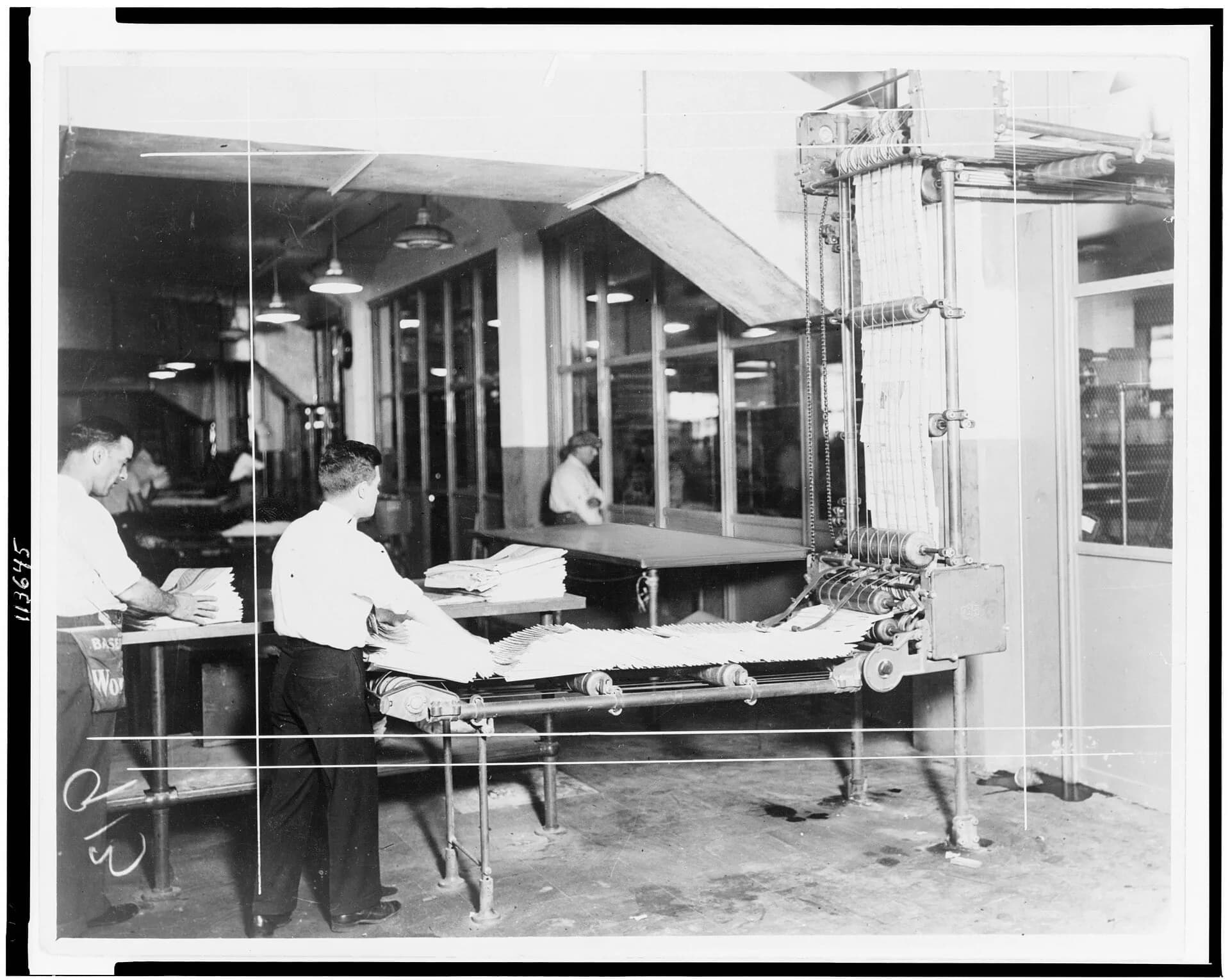 Newspapers being stacked in a delivery room